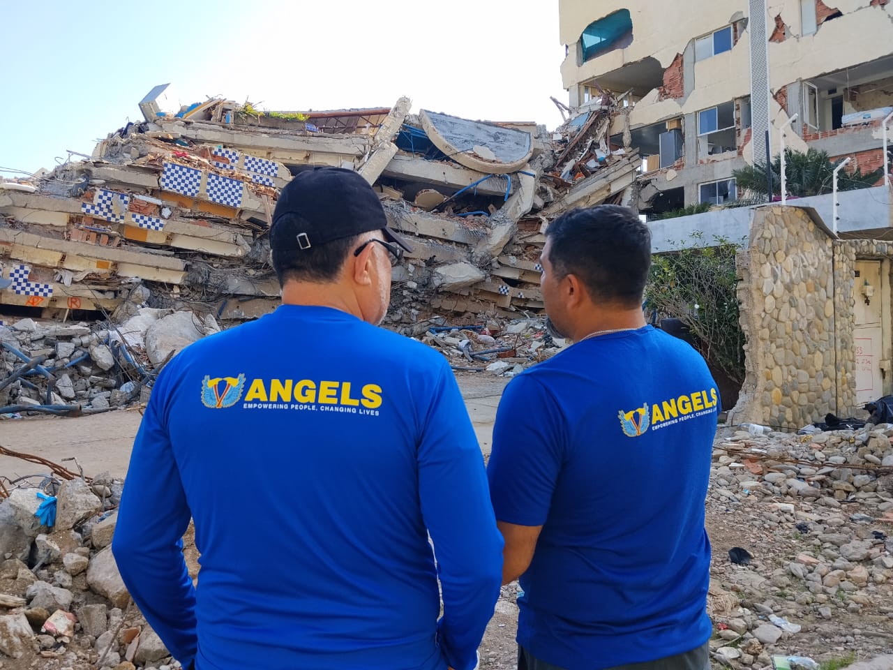 VER volunteers in blue V-Angels shirts serving in the field